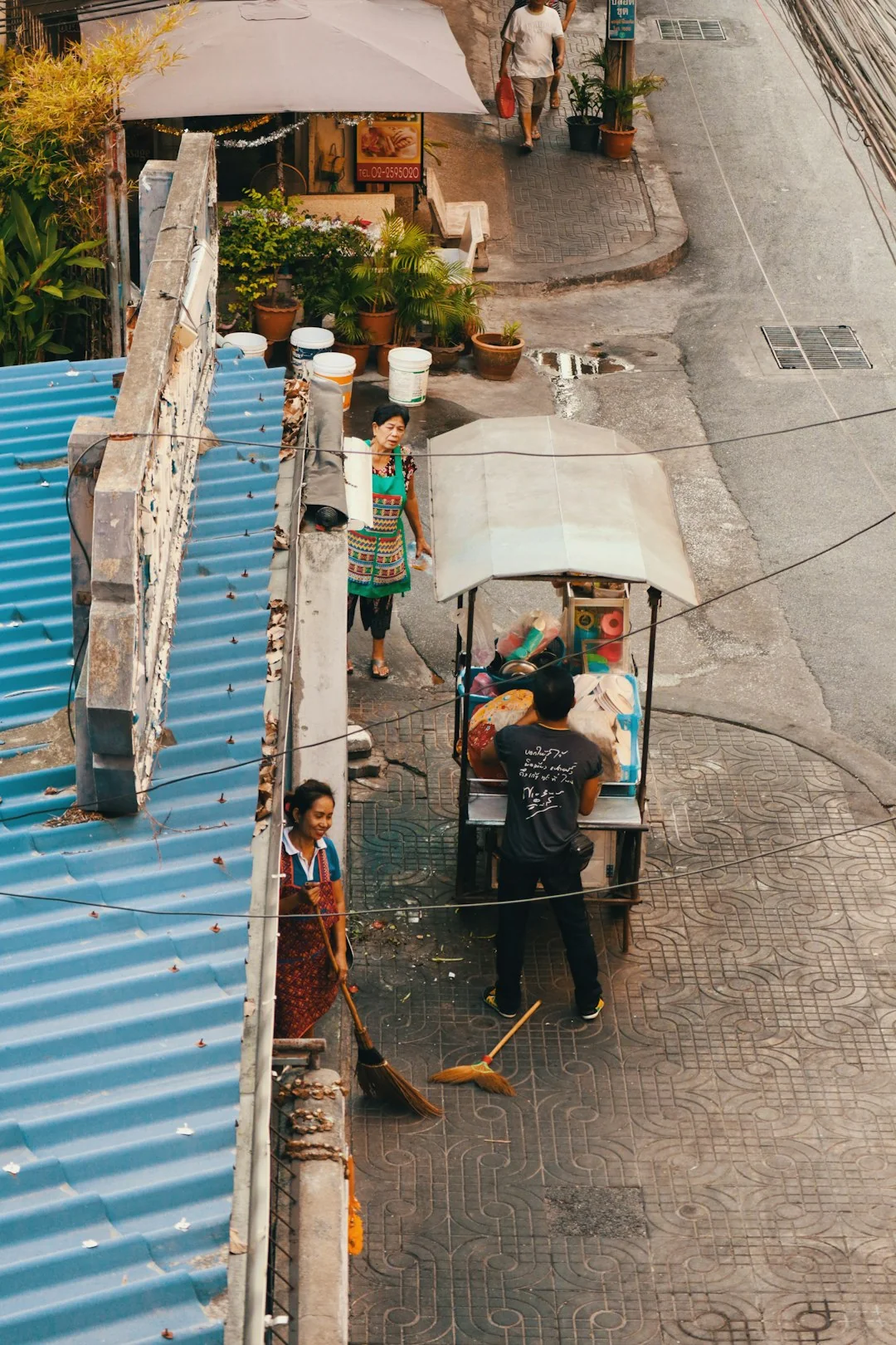 A worker in protective gear disinfects a kitchen, ensuring a clean and safe environment.